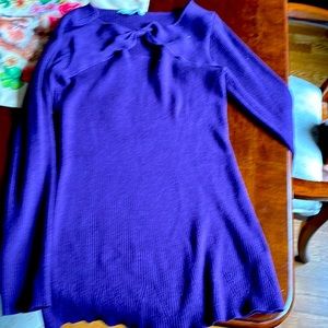 Woman’s rayon and polyester top. Size xl but more like a medium. Dark purple.